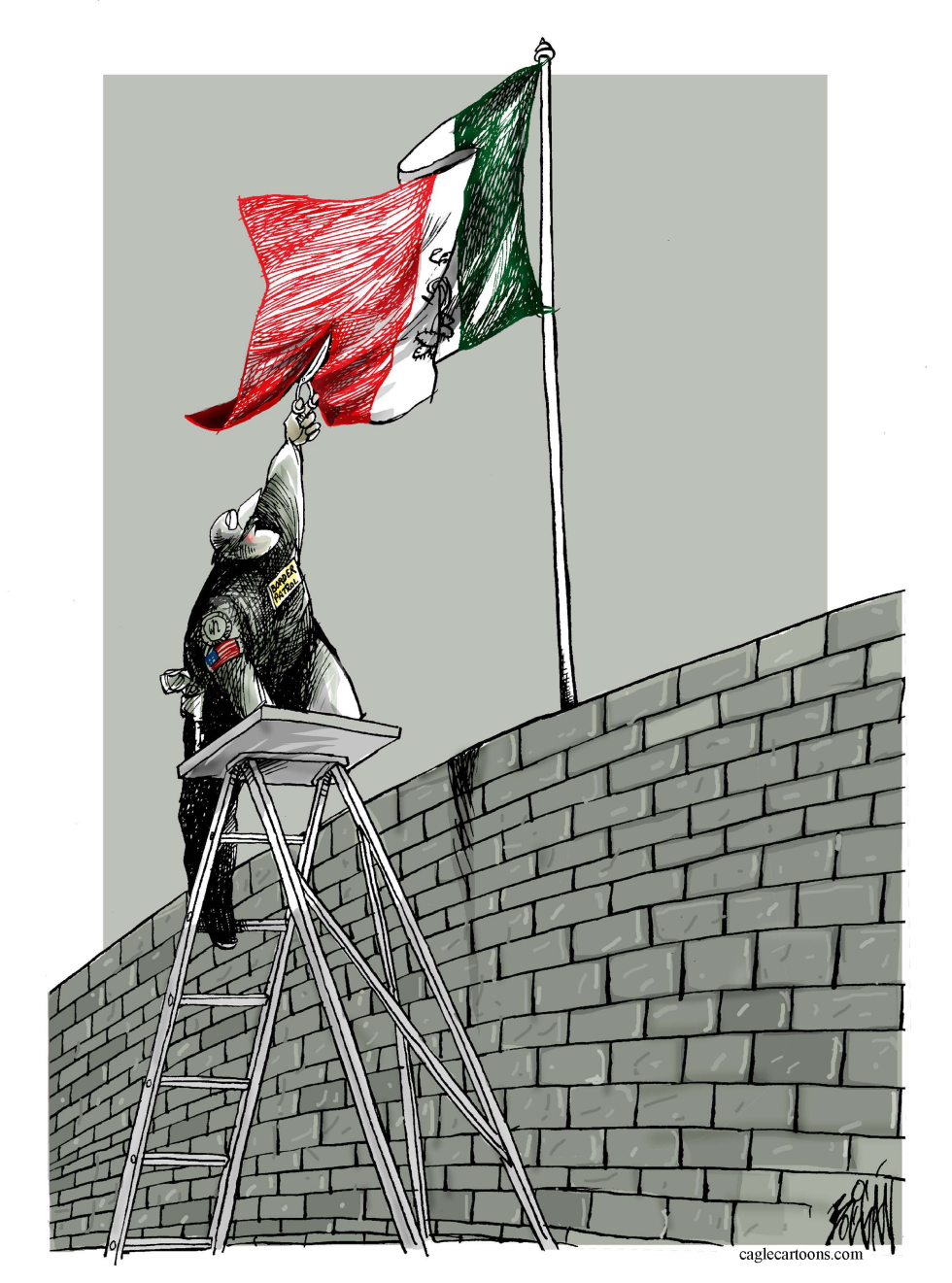 Border agent adjusts flag above brick barrier