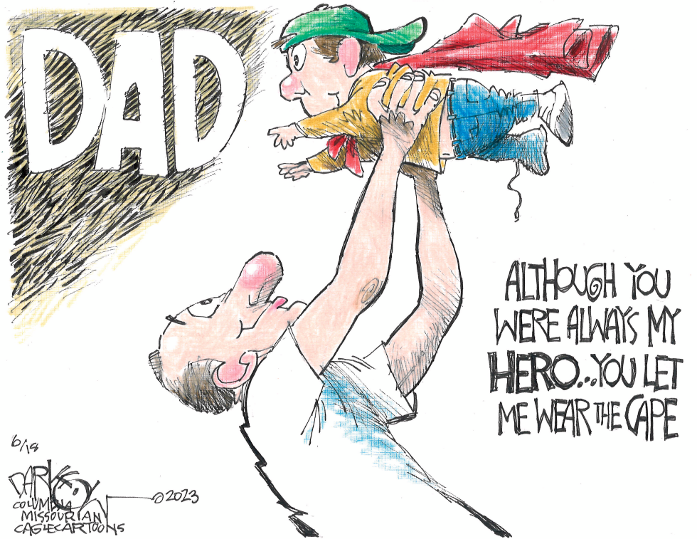 Father lifts superhero-costumed child while affirming mutual heroism in warm family scene.