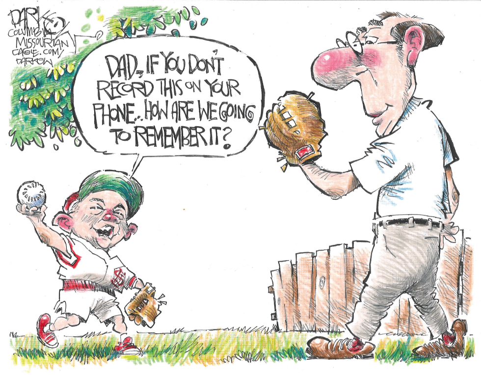 Father son baseball scene questions phone use for memory during fathers day play.